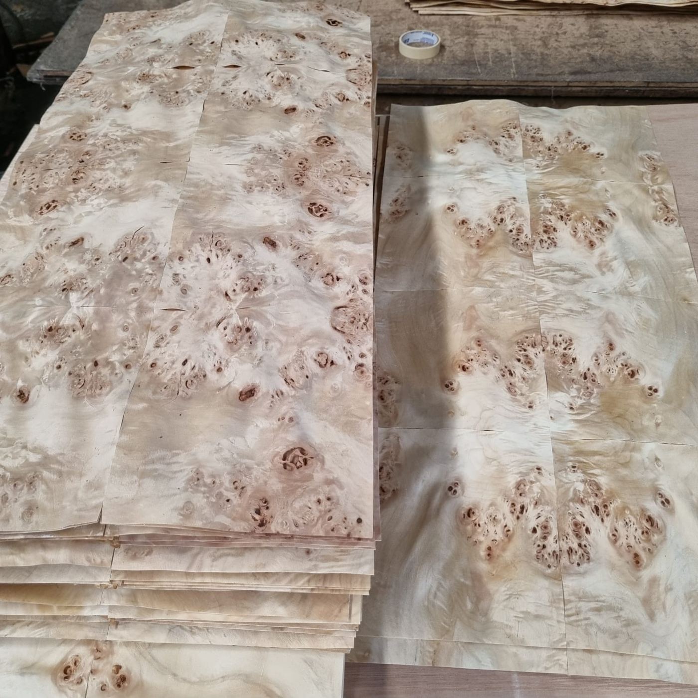 Stacks of matched burl veneer sheets